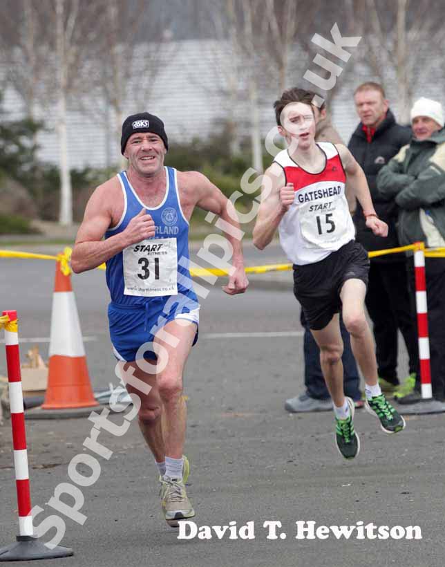 Brian Rushworth (Sunderland) can't hold off the Gateshead athlete in the senior mens Elswick Road Relays.